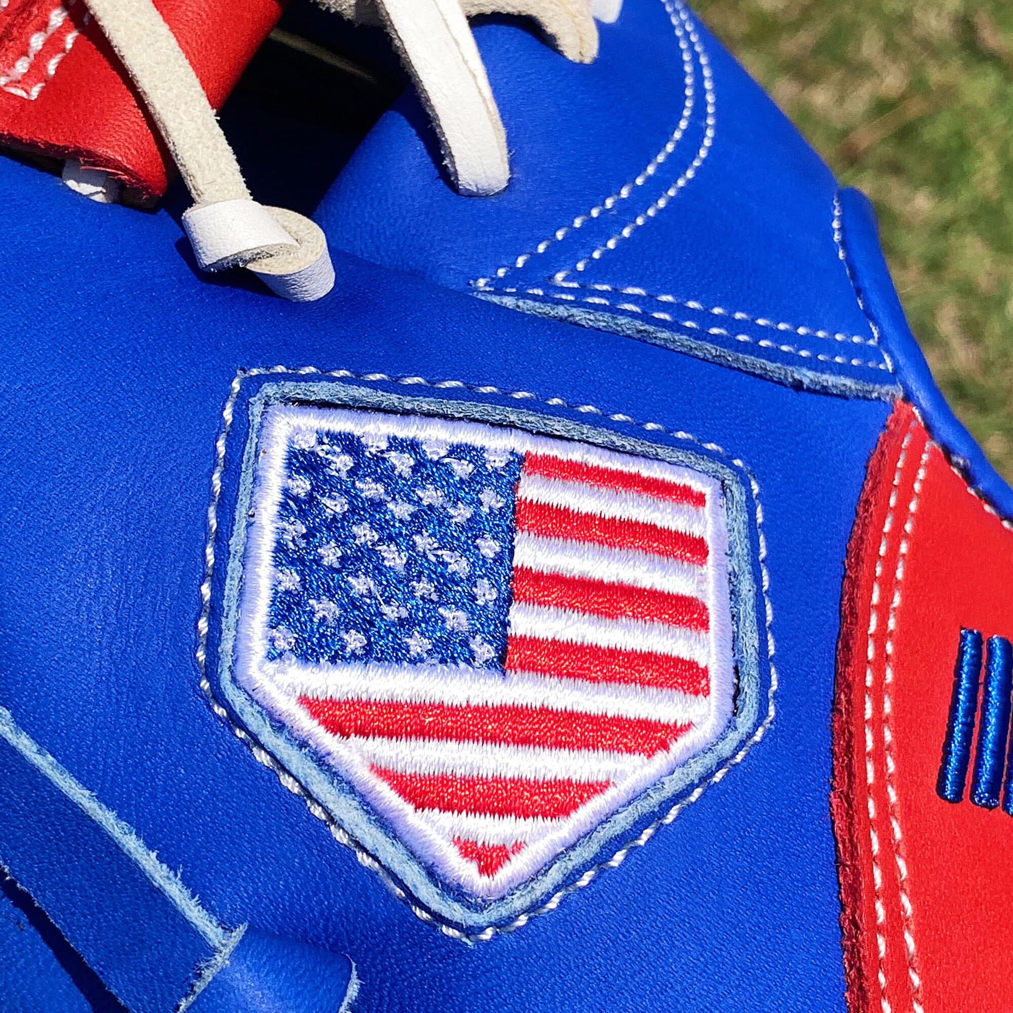 Red white and hot sale blue cleats baseball